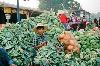 Photo art by Jim Delcid: vibrant market scene at Inle Lake in Myanmar