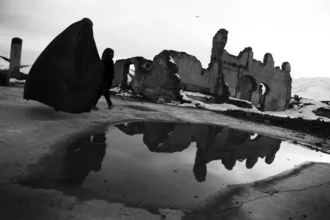 Photo art by Rada Akbar: Footprint of war in Kabul, mother with child in ruins.
