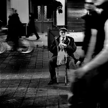 Photo art by Didier Guibert: people in motion in a busy street scene.