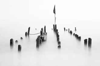 Photo art depicts a serene seascape with poles in the water.