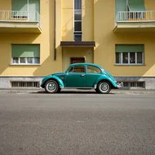 Photo art: a nostalgic Beetle parked on an urban street in Italy.