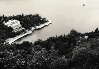 Photo art by Andreas Odersky: calm black-and-white image of a boat at the coast