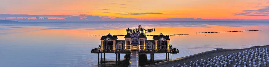 Beautiful dawn over Sellin Pier at the Baltic Sea beach