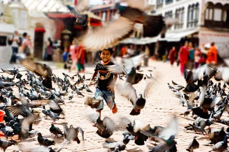 Photo art: Boy runs among pigeons in a square in Kathmandu, Nepal.