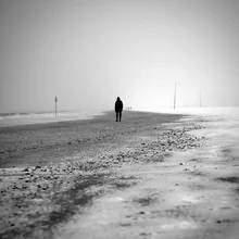 Photo art by Emiliano Grusovin: lonely walk on the frozen beach in Rimini