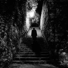Dramatic photo art by Emiliano Grusovin: man on a staircase in black and white
