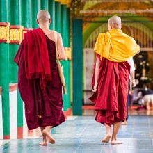 Photo art by Davide Carnevale: Monks in Myanmar meditating in a serene setting.