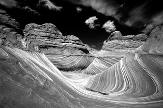 Photo art by Peter Fauland: surfer riding a wave in the desert