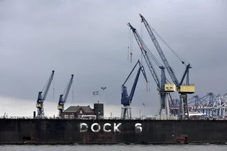 Photo art by Markus Hertrich: clouds above Hamburg docks and river landscape