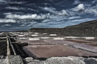 Photo of salt pans in La Palma, clouds drifting across the sky.
