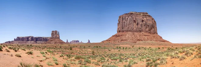 Photo art by Melanie Viola: Expansive Monument Valley landscape with striking sandstone formations.