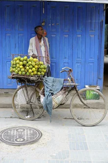 Photo art by Markus Hertrich: street vendor at a market in Kathmandu, Nepal.