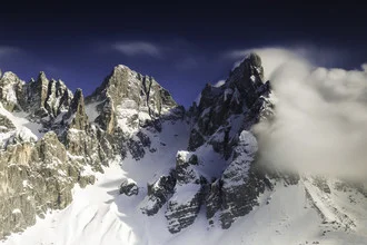 Photo art by Christian Schipflinger: cold mountains in winter with snow-covered peaks.