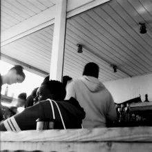 Portrait of a dreamer in black and white at a beach bar