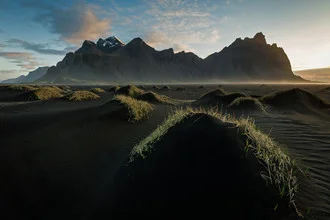 Black sand and dunes under the Iceland sky, calm morning atmosphere.