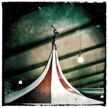 Photo art by Frank Wöllnitz: surreal circus under a starry sky.