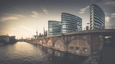 Wall art depicting a cityscape at sunset over the Spree river.