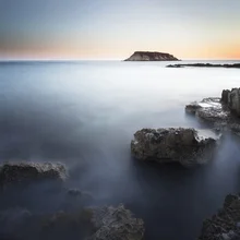 Photo art by Ronnie Baxter: gentle waves and rocks at dawn in Cyprus