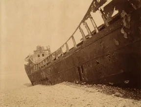 Photo art by Andreas Kersten: stranded ship in the vast ocean