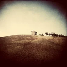 Photo art by Michael Meinhard: house on a hill in the Italian landscape