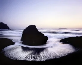 Calm sunset over Trinidad Beach, gentle waves, and sparkling water.