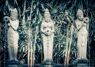 Photo art by Heinz Plitzko: three god statues in a serene setting in Bali