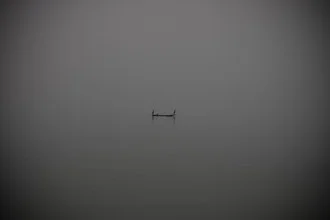 Water landscape with a fishing boat in Sierra Leone, calm mood on the sea.