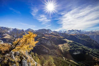 Photo art by Markus Van Hauten: warm day with sun and blue sky above the mountains.
