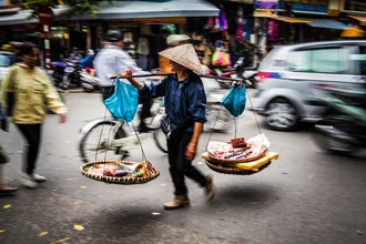 Photo art by Jörg Faißt: lively street scene in Ha Noi featuring street vendors.