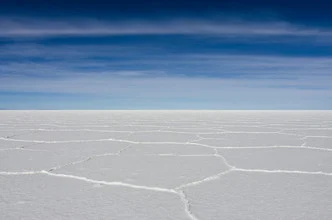 Photo art by Rolf Lange: salty horizons under a blue sky in Uyuni, Bolivia.