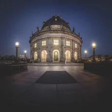 Beautiful photo art of the Bode Museum at night with soft lighting.