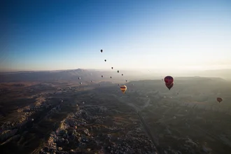 Photo art by Carla Drago: hot air balloons rising over Cappadocia at sunrise