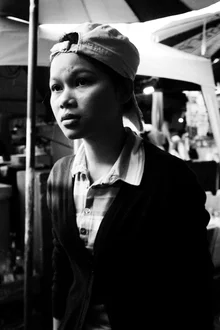 Photo art by Christian Fischer: girl with a swimming cap at Chatuchak Market in Bangkok