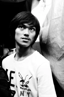 Black and white photo of a man at Chatuchak Market in Bangkok