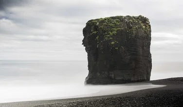 Photo art by Lucas Jackson: calm coastal landscape with rocks and clouds