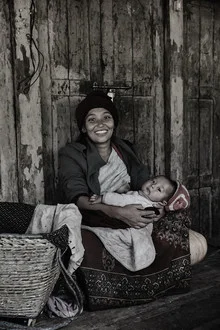 Wall art by Jan Møller Hansen: mother and child in soft light in Nepal