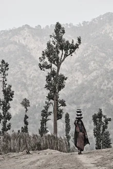 Photo art by Jan Møller Hansen: woman carrying water in the Himalayas