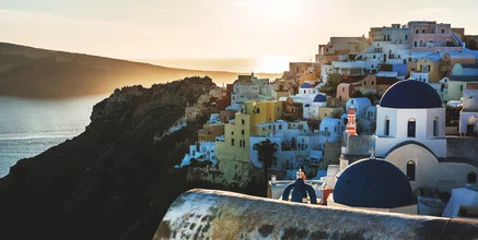 Photo art by Jean Claude Castor: idyllic village in Santorini at sunset