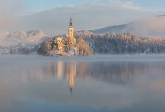 Photo art by Aleš Krivec: serene view of the snowy Lake Bled on a winter morning