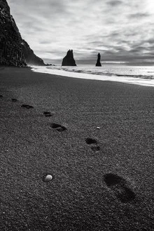 Photo art by Christian Schipflinger: footprints in the sand on a black beach