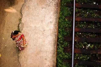 Photo art by Lucas Paolo K: local woman at a train station in Hikkaduwa, Sri Lanka.