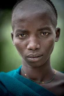 Portrait of a Suri warrior from Ethiopia, gazing proudly at the camera.