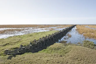 Photo art by Petra Seiderer: calm North Sea with sky and water at low tide