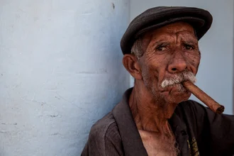 Photo art of an older man with a cigar in Havana, relaxed Caribbean vibe.