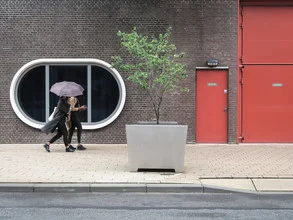 Photo art by Anuschka Wenzlawski: women with umbrellas in an urban setting