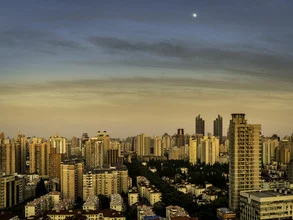 Photographic depiction of a moonlit cityscape in Shanghai