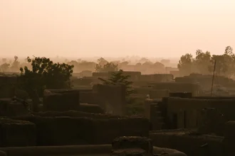 Photo art by Mathias Becker: adobe huts with traditional roofs in Djenné, Mali