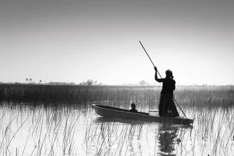 Photo art by Tillmann Konrad: fisherman by the calm river in Botswana