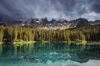 Photo art by Philip Gunkel: tranquil lake with reflecting mountains and clouds in the background