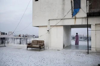 Photo art by Enok Holsegaard: women watching children on the roof during the kite festival.